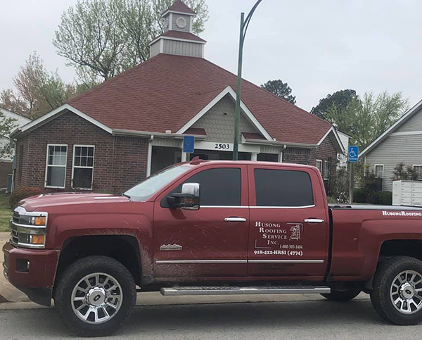 Husong Roofing Service Truck With Logo On It